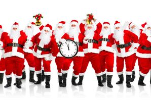 photo of Santas holding a clock
