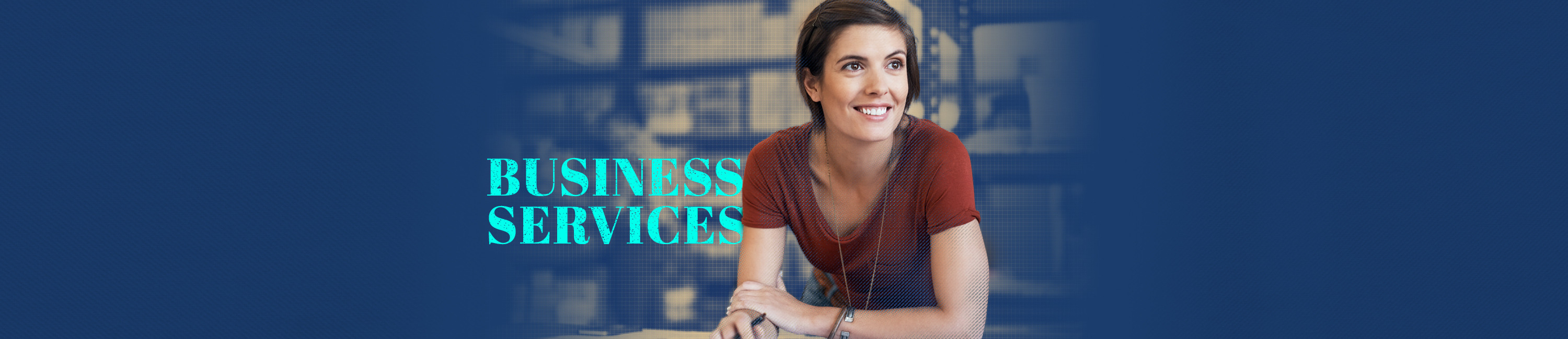 young woman sitting at a table and smiling due to the help she received from Fidelity Bank & Trust Business Services. Words on photo say Business Services