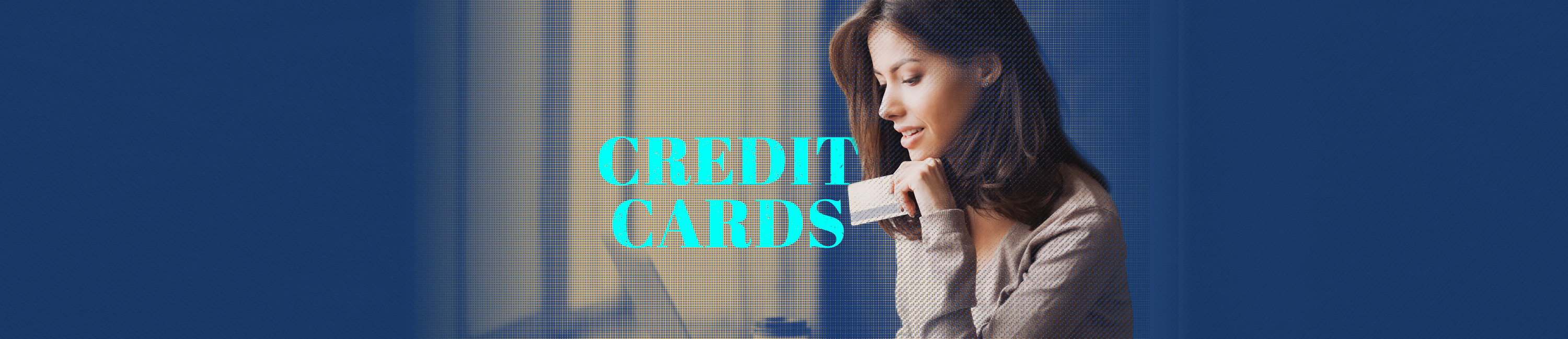 young woman working on a computer while holding her Fidelity Bank & Trust VISA credit card. words on photo say Credit Cards